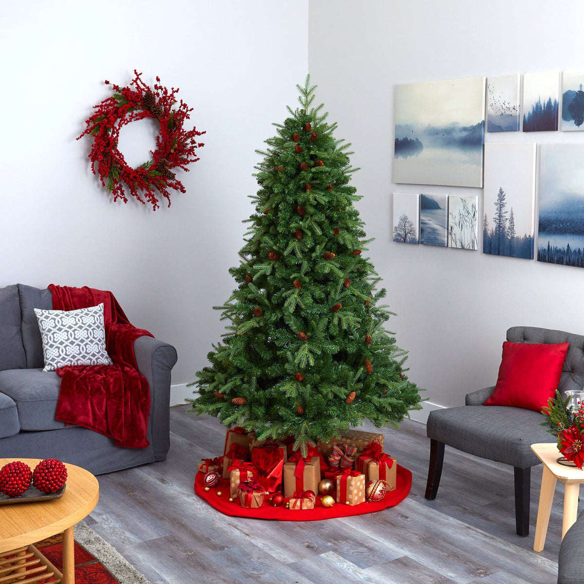 a christmas tree in a room with a couch and a wreath