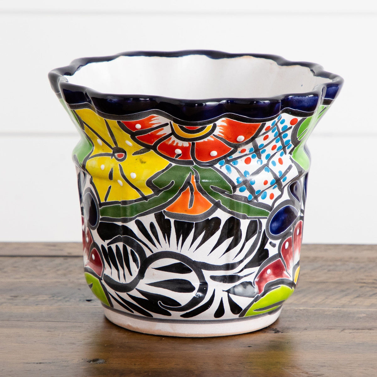 a colorful vase on a table