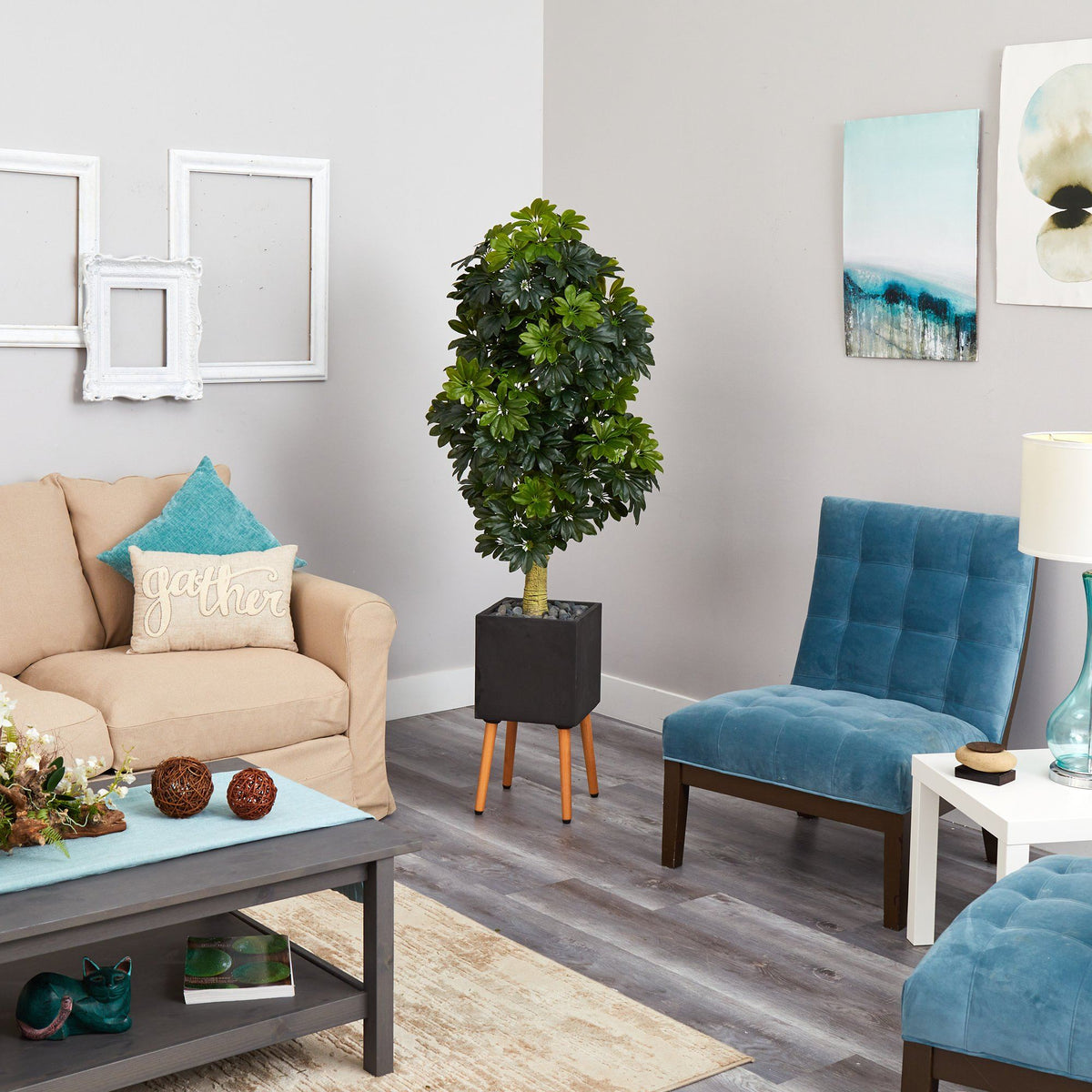 a living room with a couch and a tree