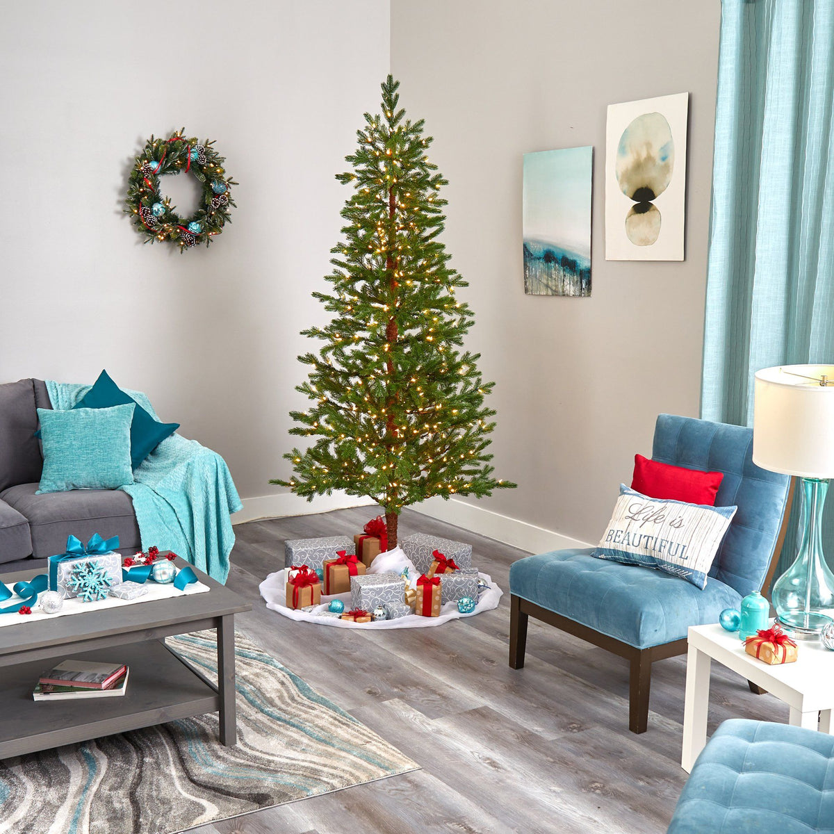 a living room with a christmas tree and a couch