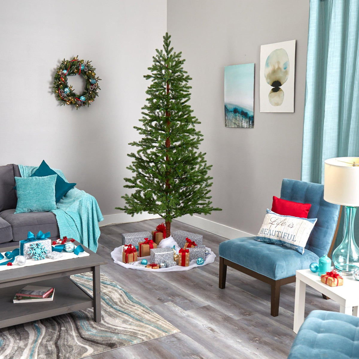 a living room with a christmas tree and a couch