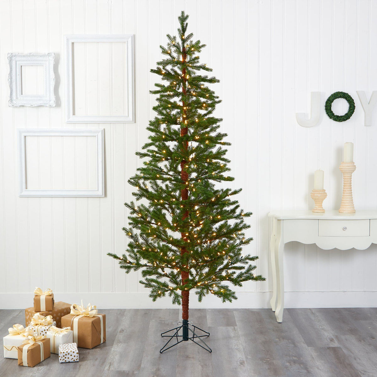 a christmas tree with lights and presents
