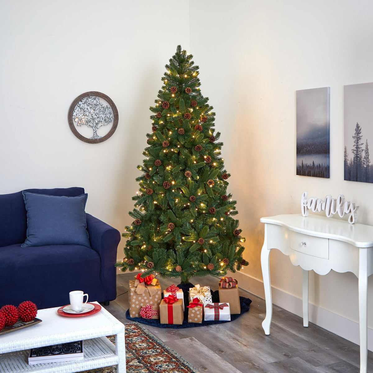 a christmas tree with presents in a room