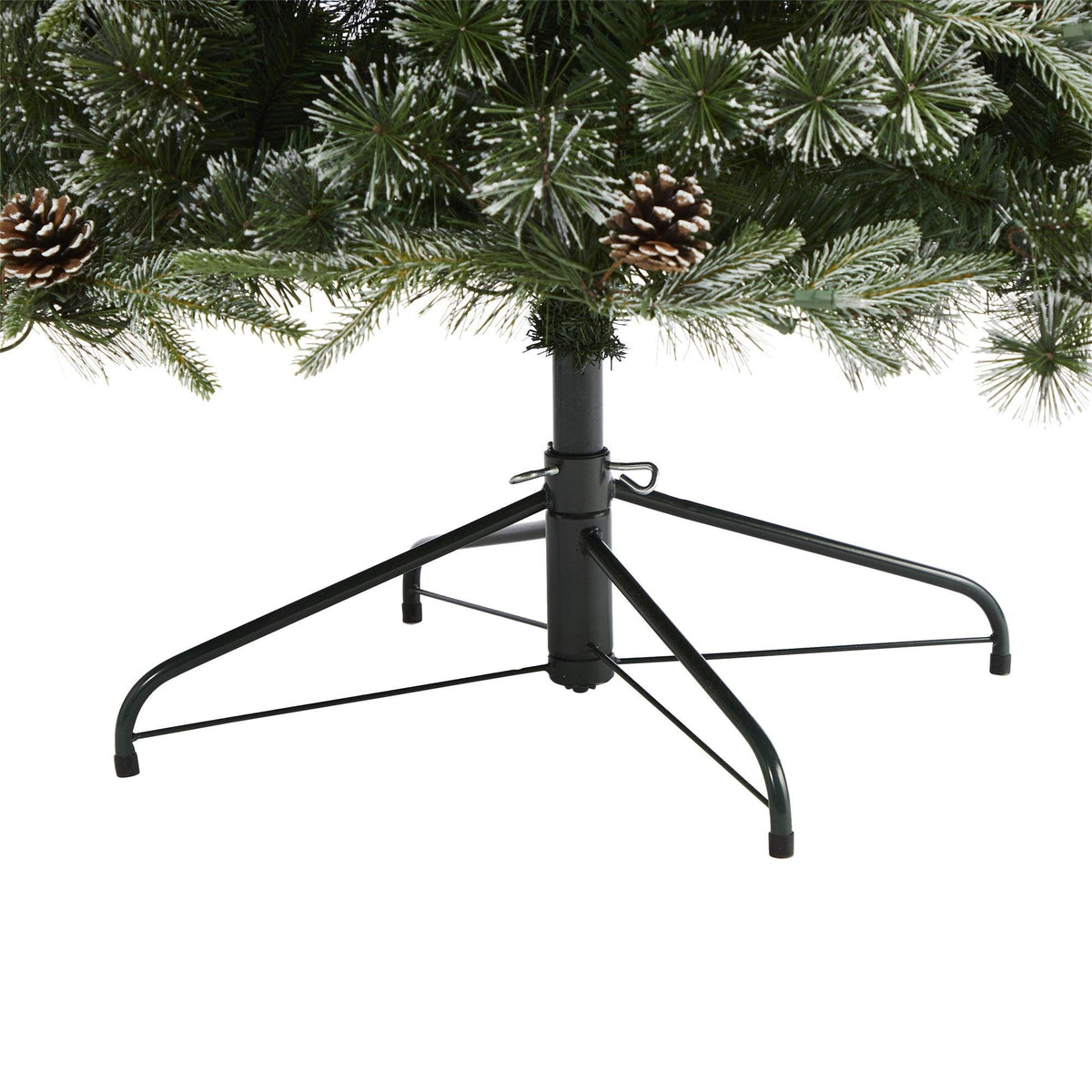 a christmas tree with pine cones and a metal base