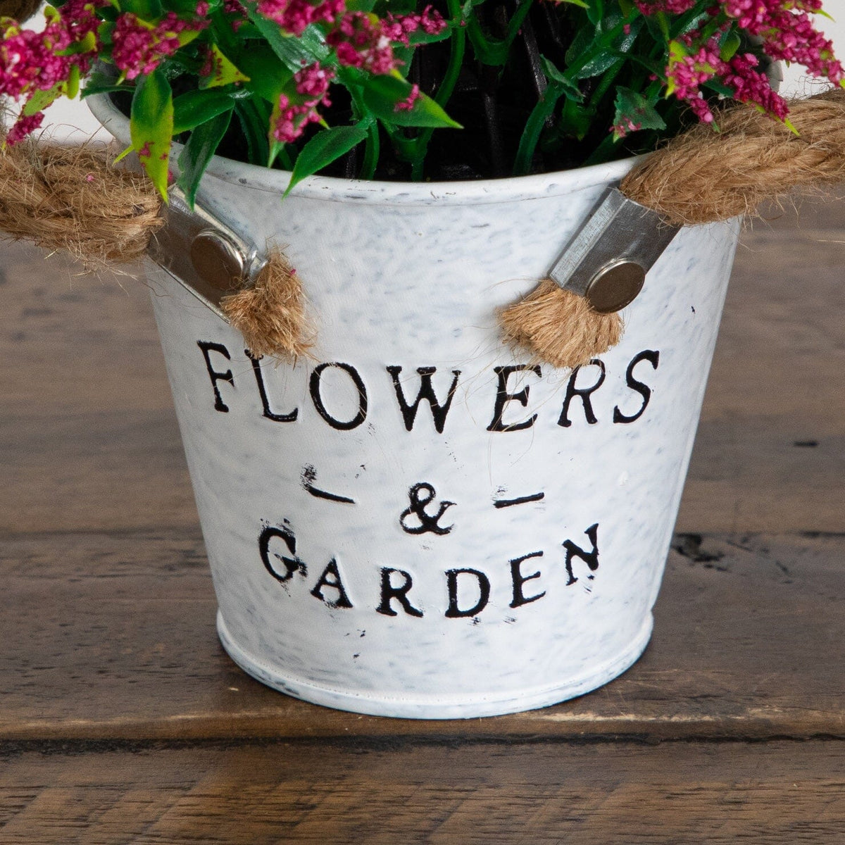 a potted plant with a rope handle