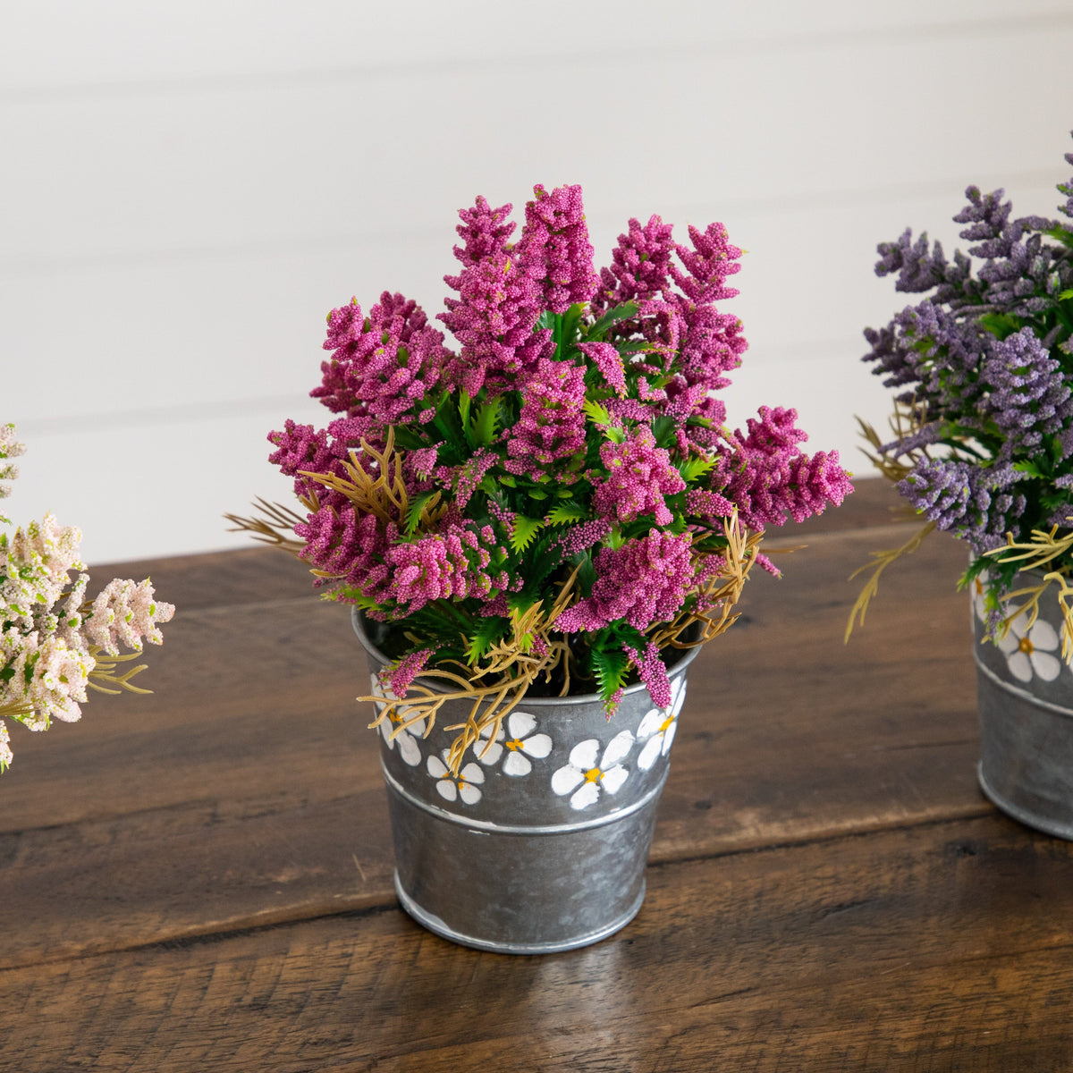 a group of flowers in a bucket