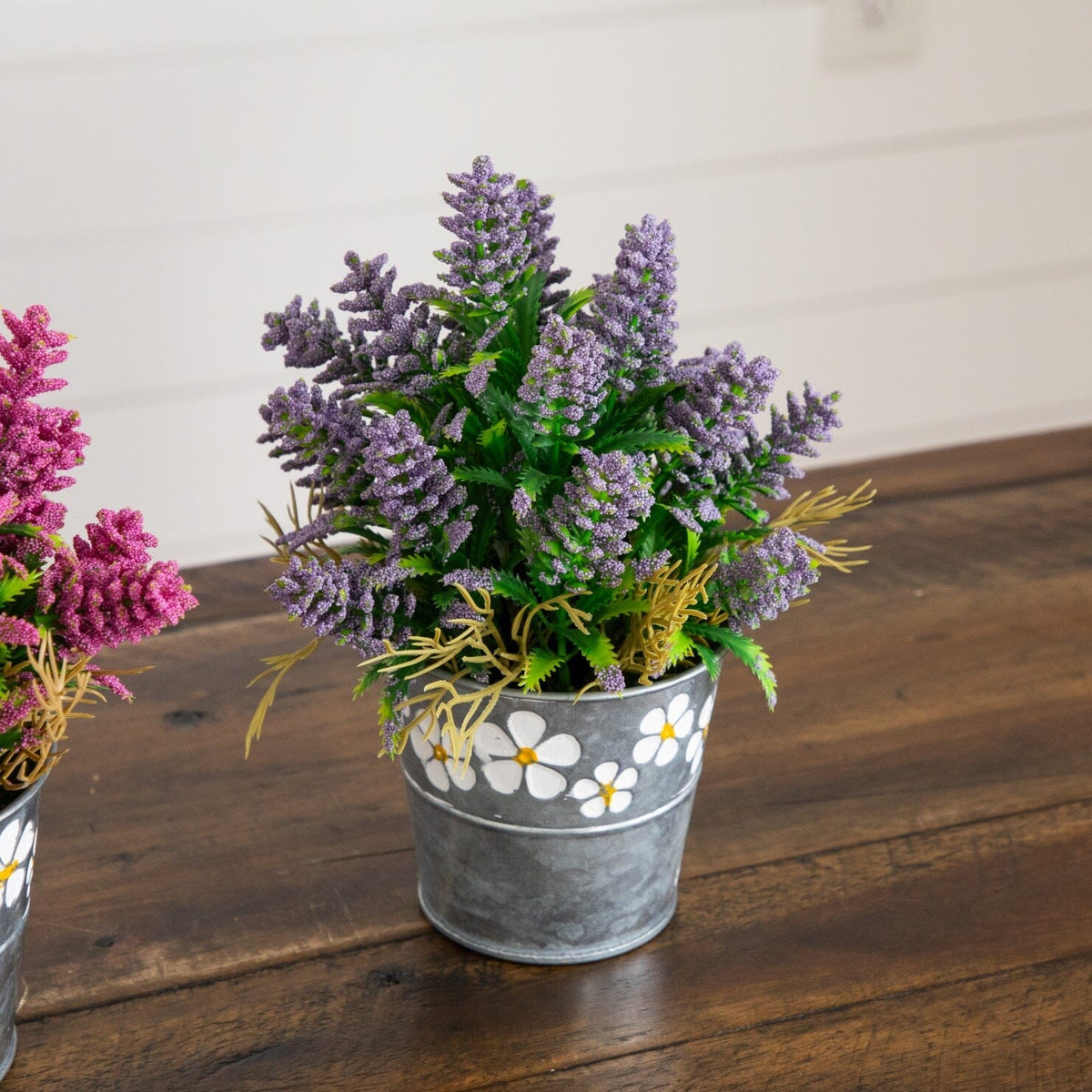 a group of flowers in a bucket