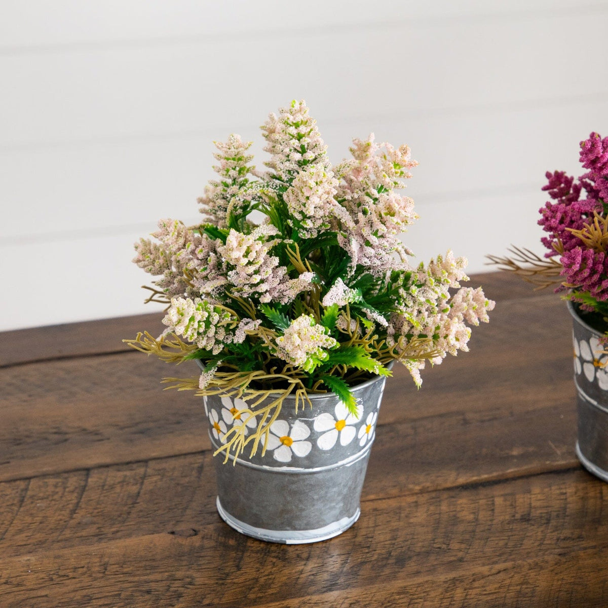a group of flowers in a bucket