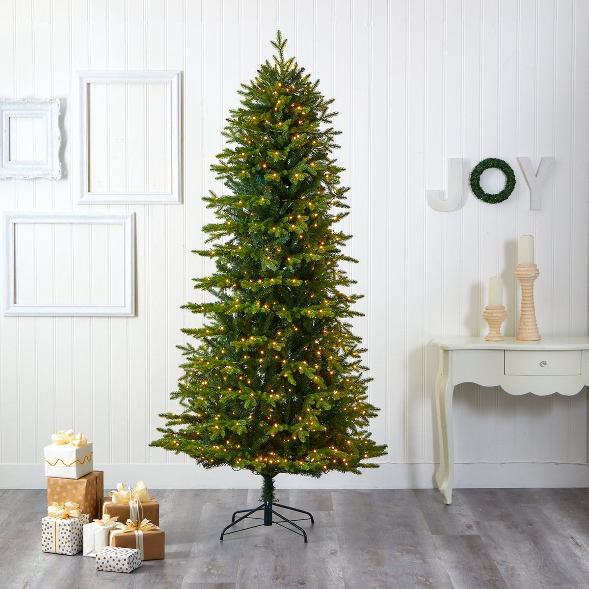 a christmas tree in a room with presents