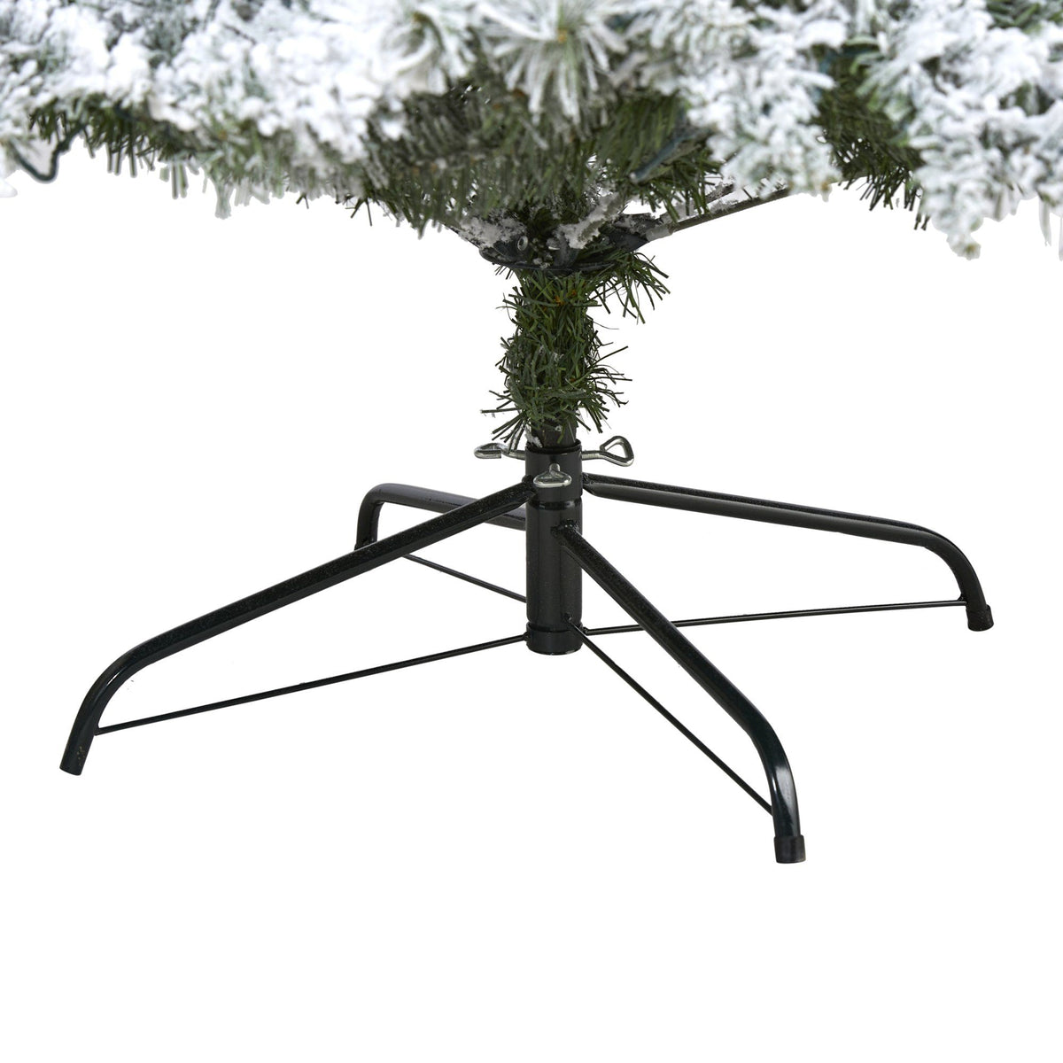 a snow covered tree on a stand