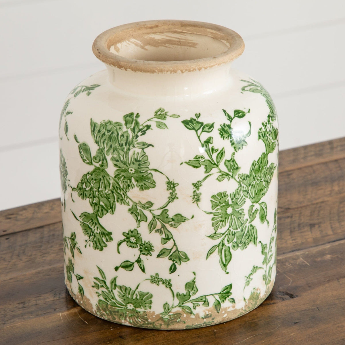 a white and green vase