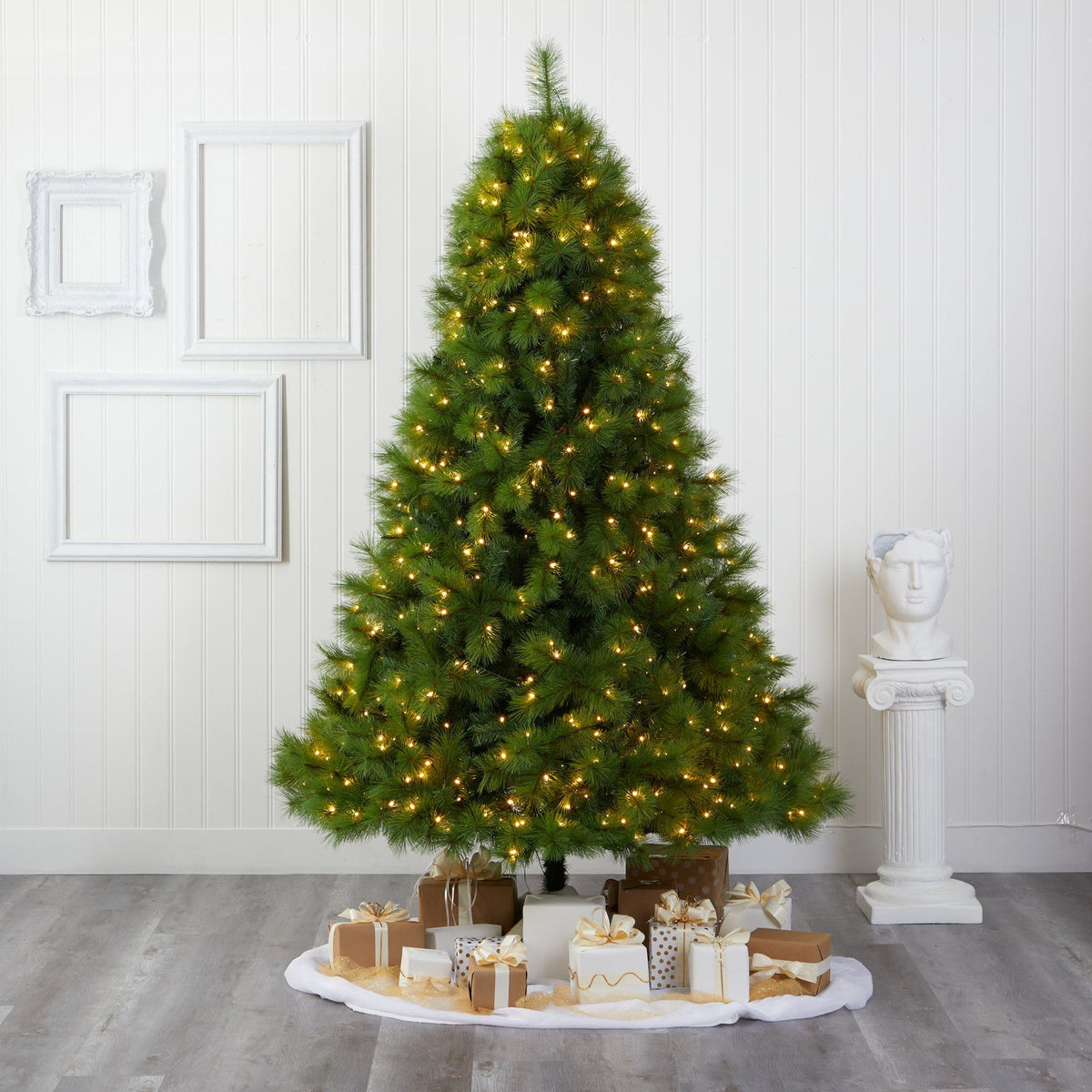 a christmas tree with lights and presents