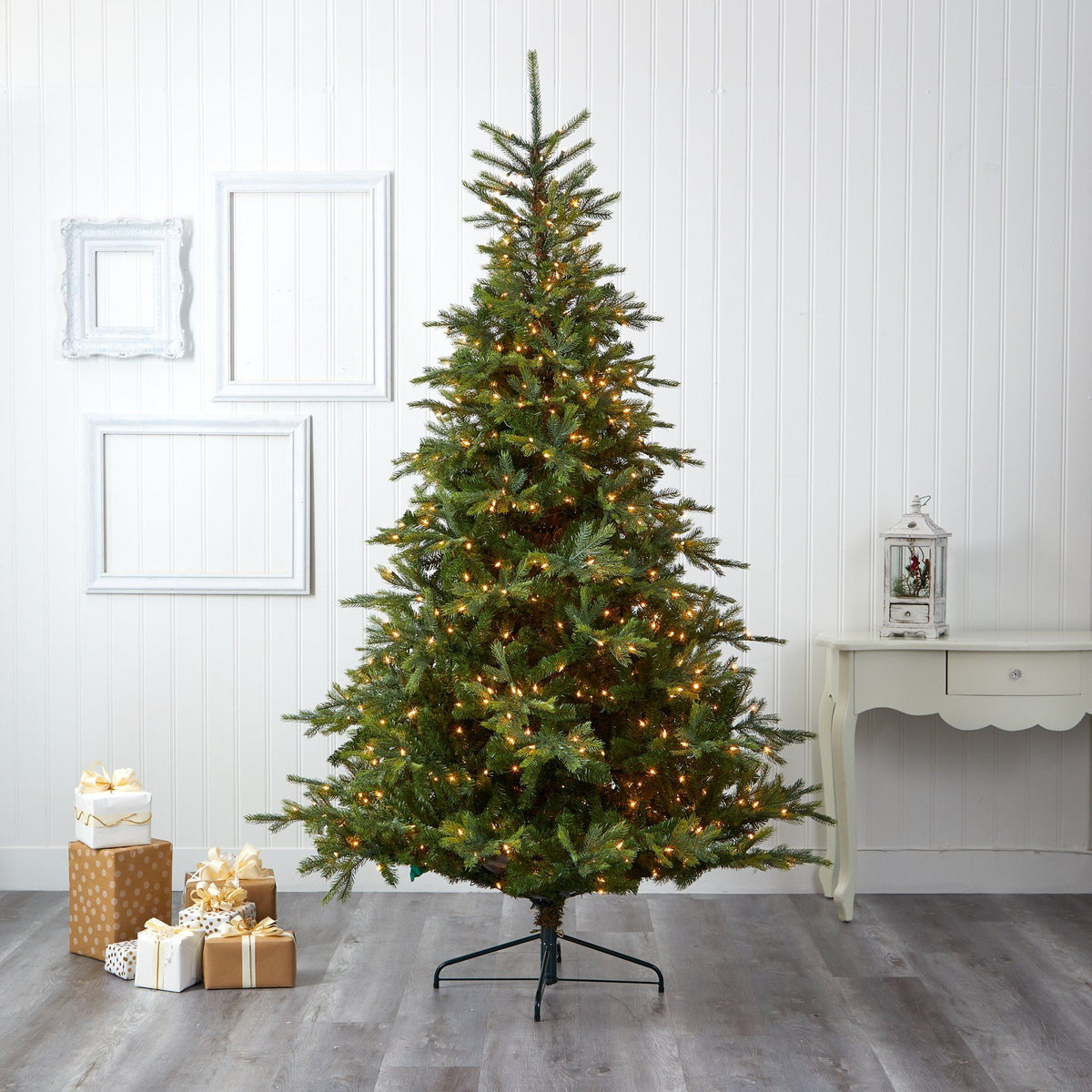 a christmas tree with lights and presents