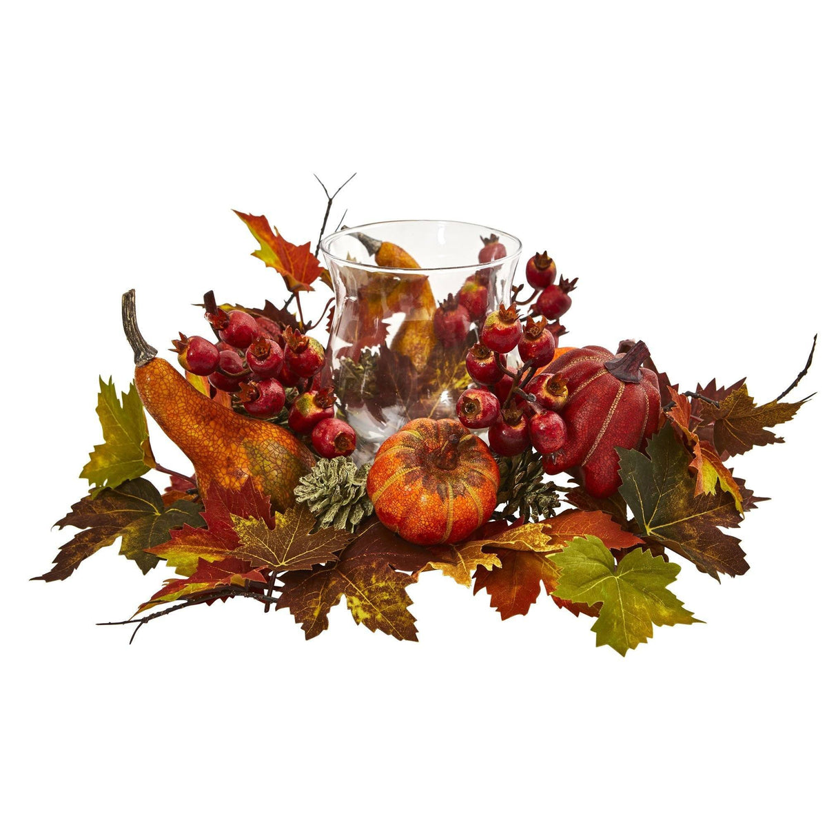 a glass vase with fruit and leaves