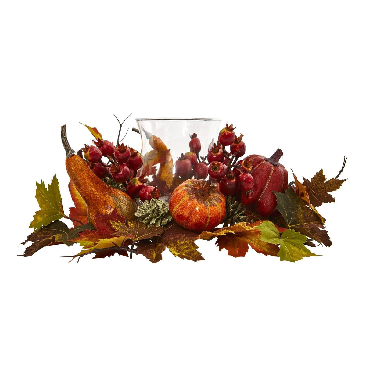 a glass vase with fruits and leaves
