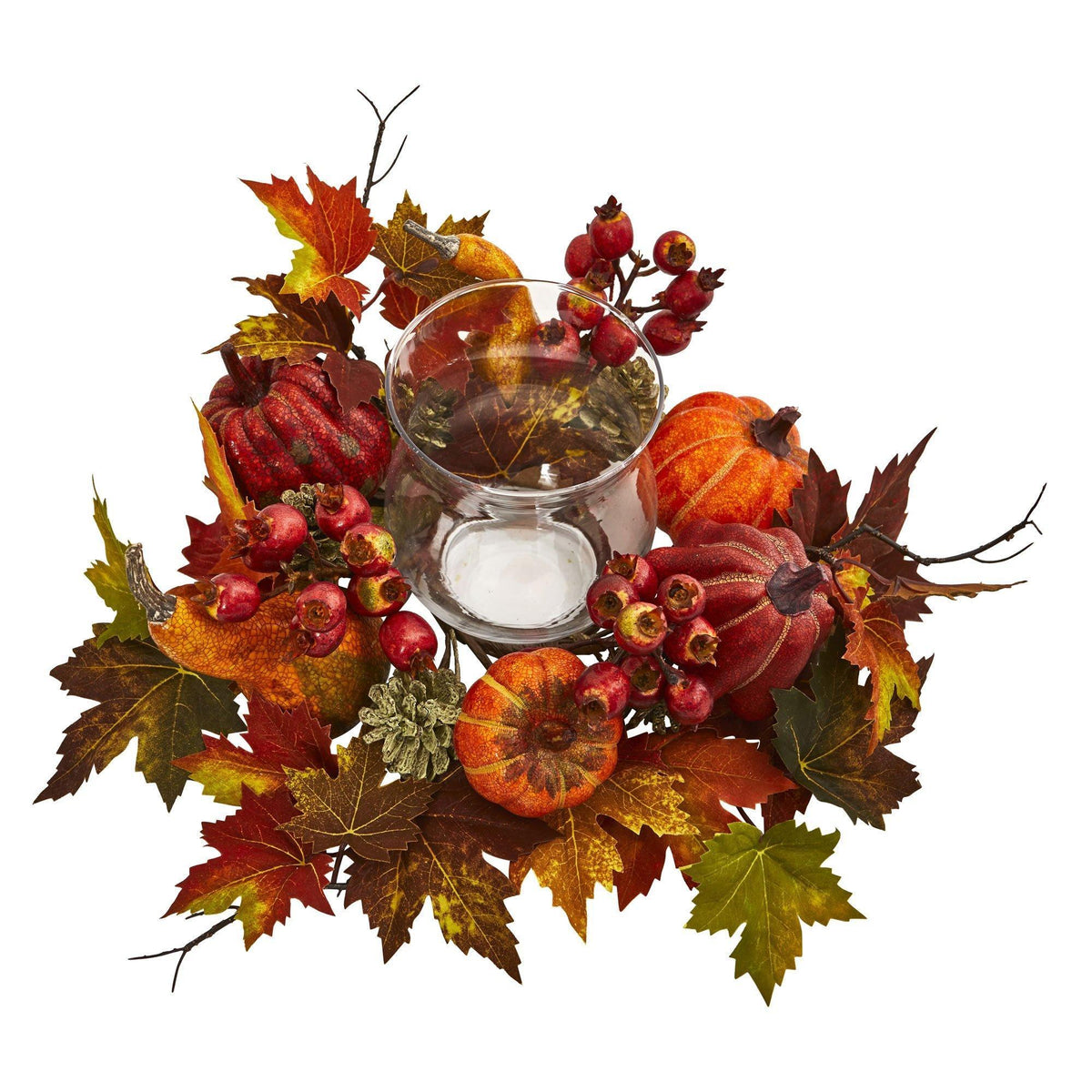 a glass vase with a candle and fall leaves