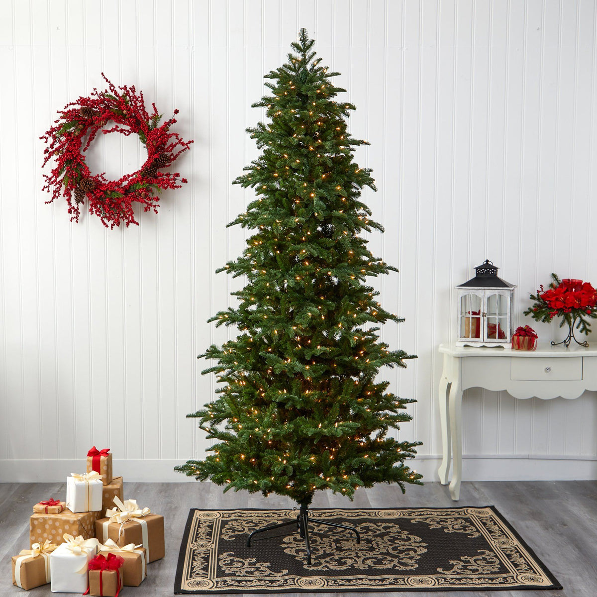 a christmas tree with lights and presents