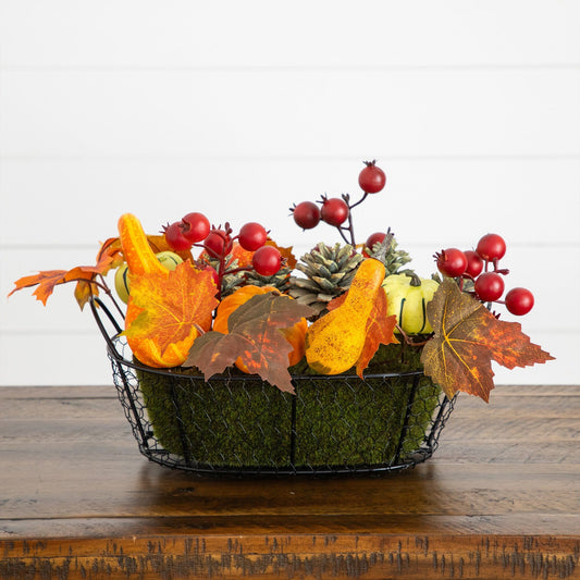 a basket of fake leaves and berries