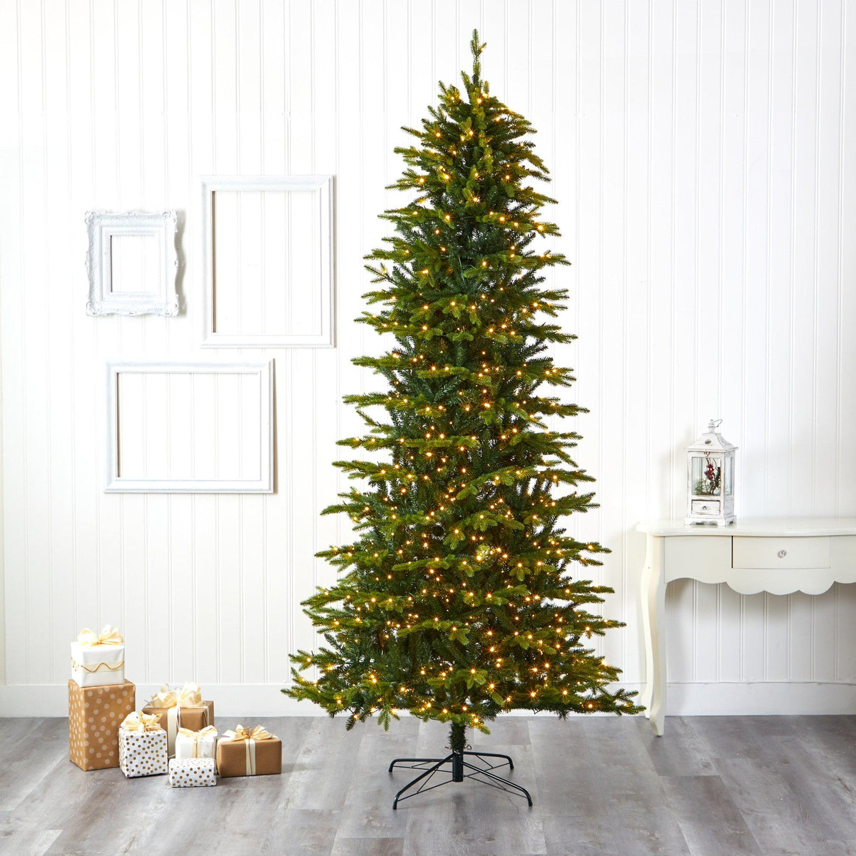 a christmas tree with lights and presents