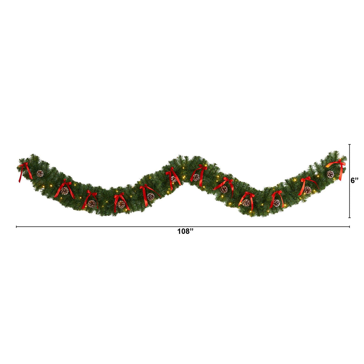 a green garland with red ribbons and bows