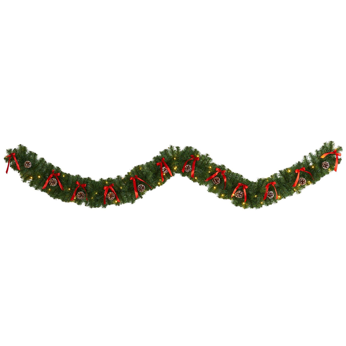 a green garland with red bows and ribbons