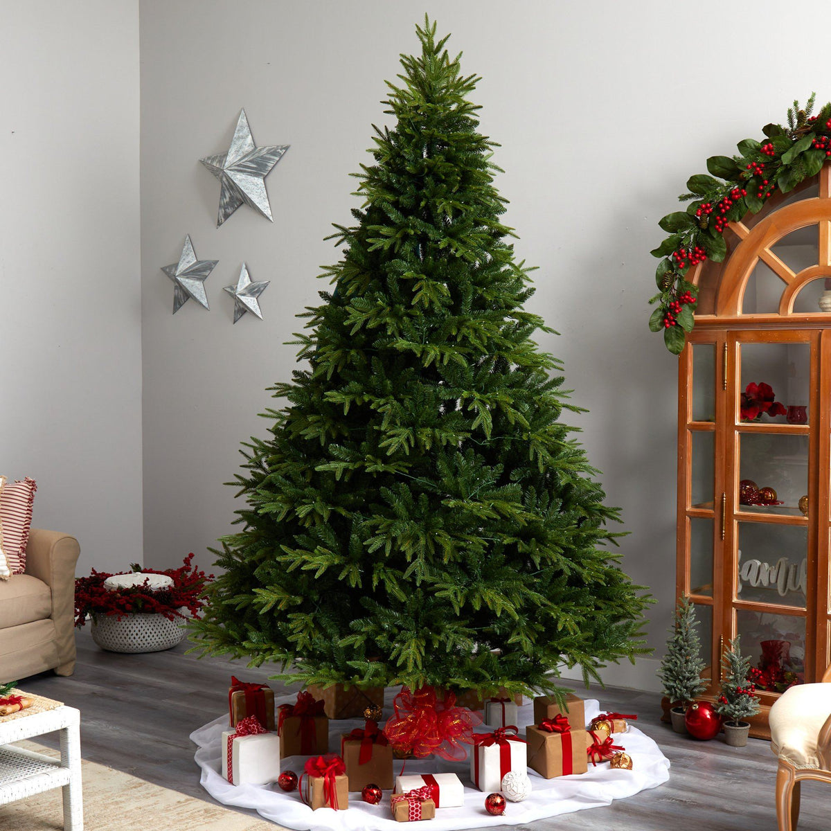 a christmas tree with presents around it