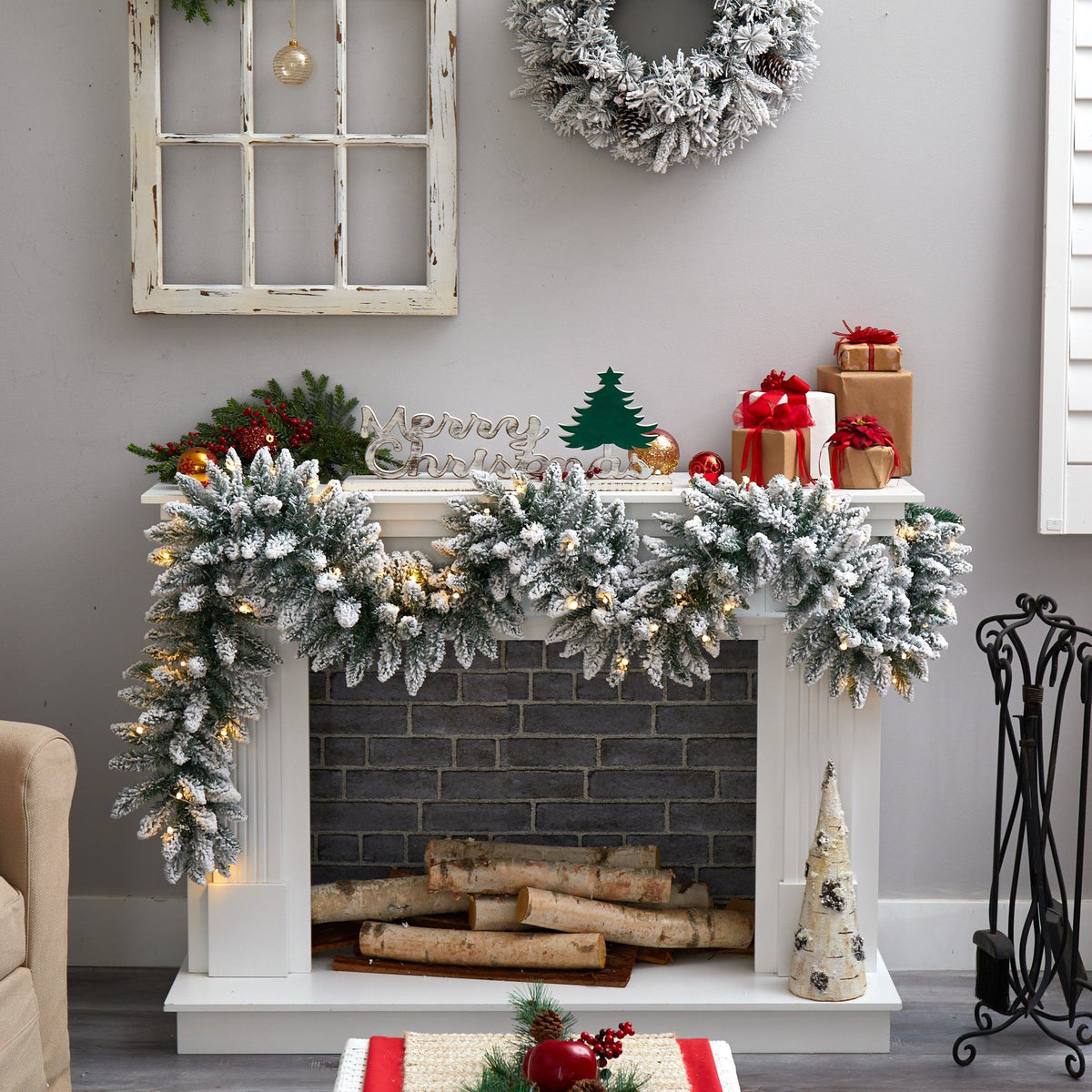 a fireplace with a wreath and a fireplace on the wall