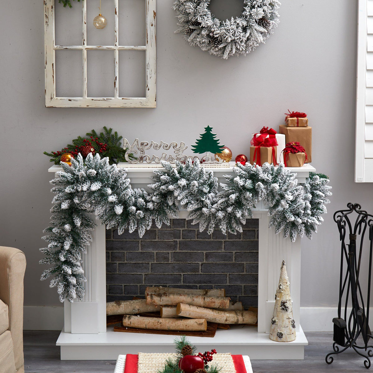 a fireplace with a wreath and a fireplace on the wall