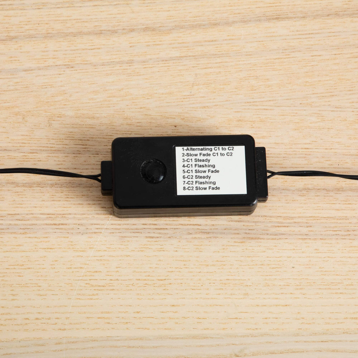 a black rectangular object with a white label on it