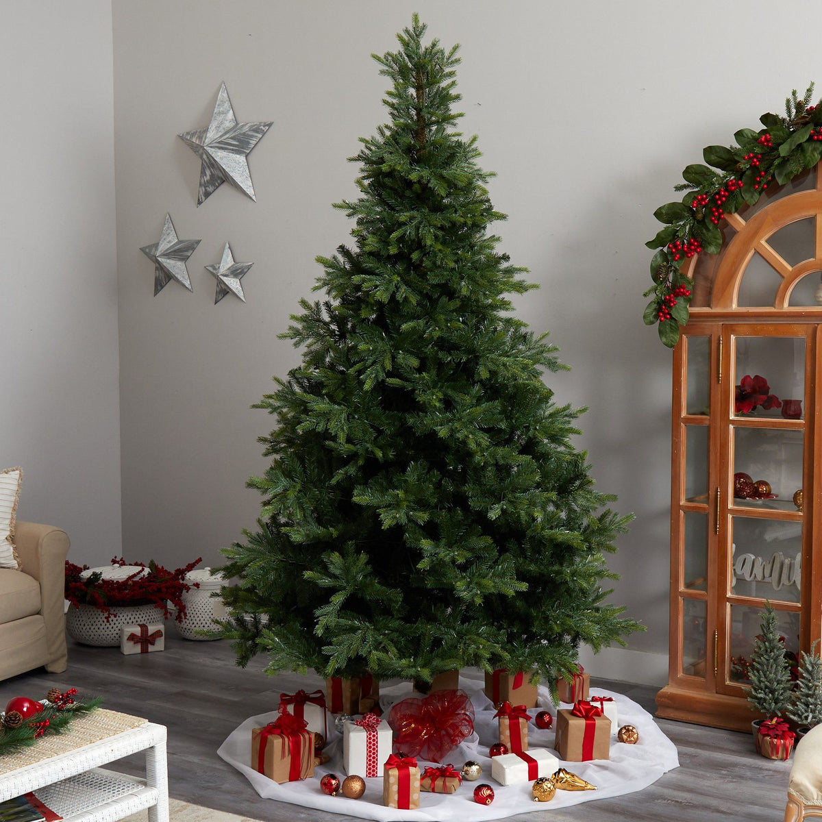 a christmas tree with presents around it