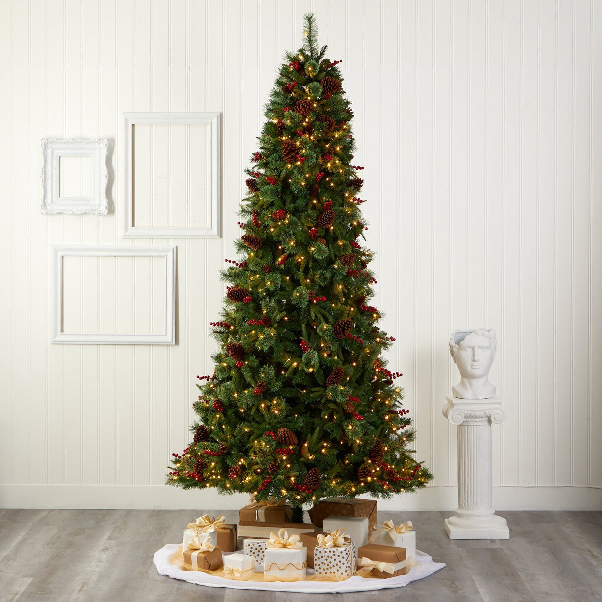 a christmas tree with presents on a rug
