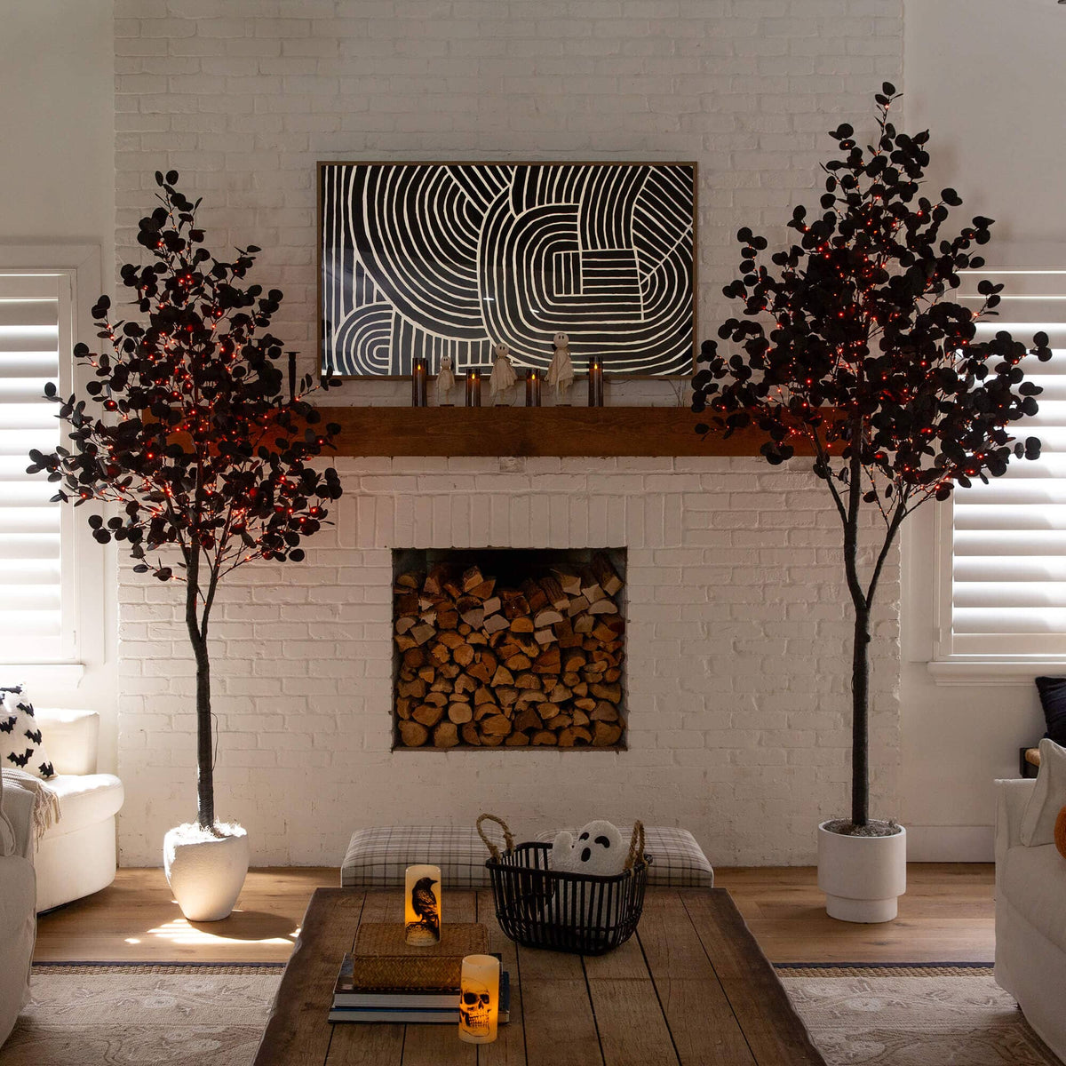 a room with a fireplace and two trees