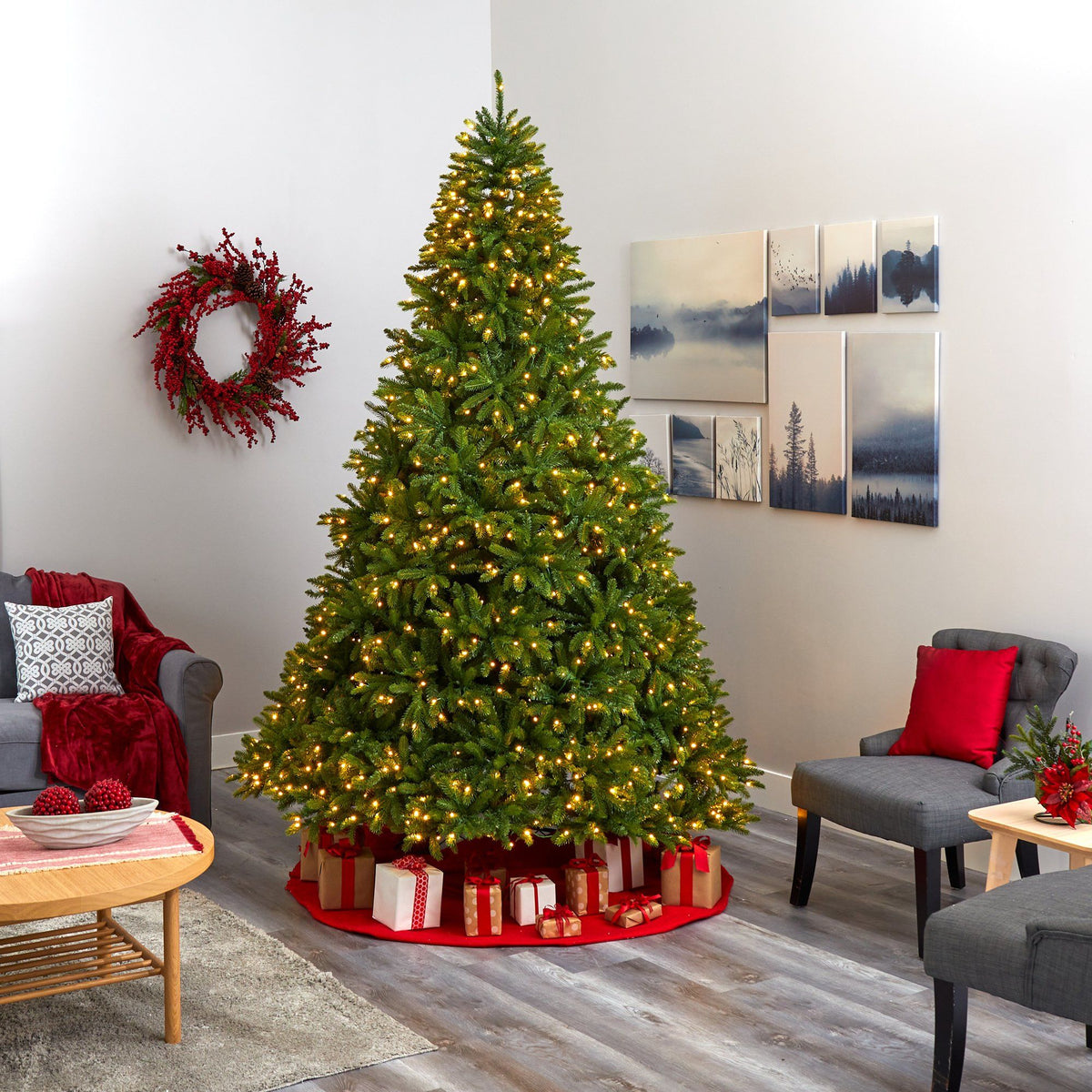 a christmas tree in a room with a couch and a wreath