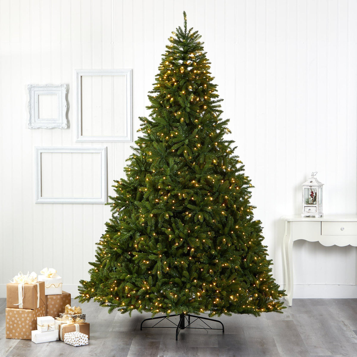 a christmas tree with lights and presents