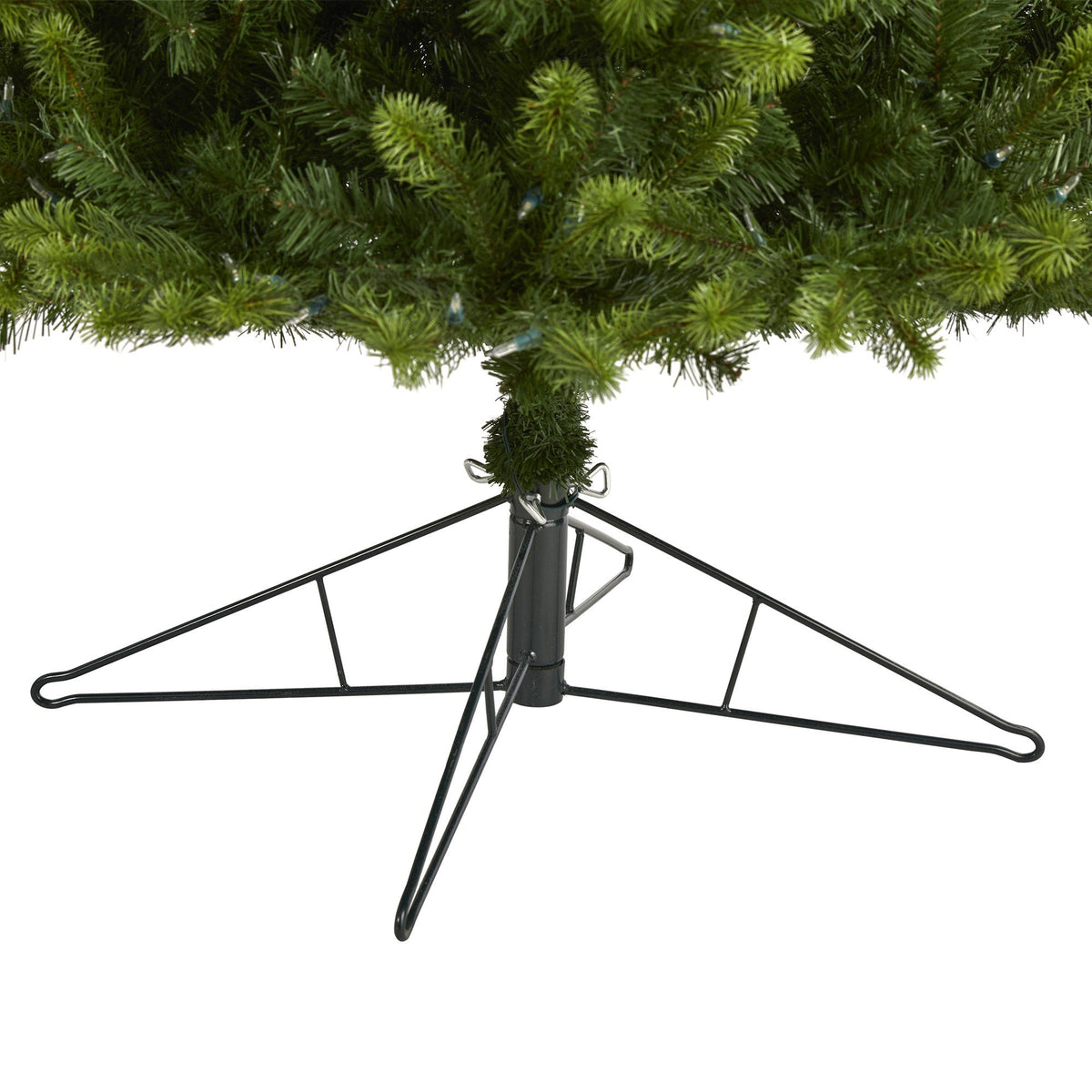 a christmas tree with a metal stand