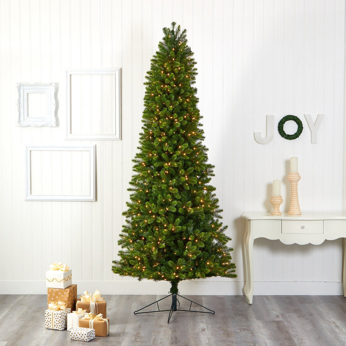 a christmas tree in a room with presents