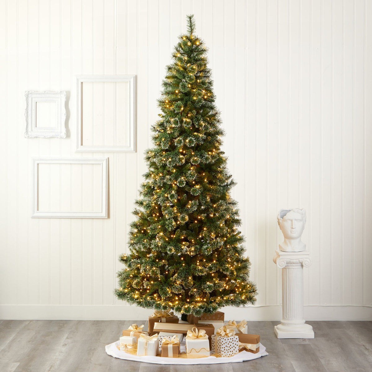 a christmas tree with lights and presents