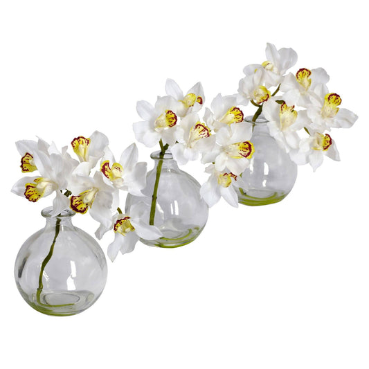 a group of white flowers in glass vases