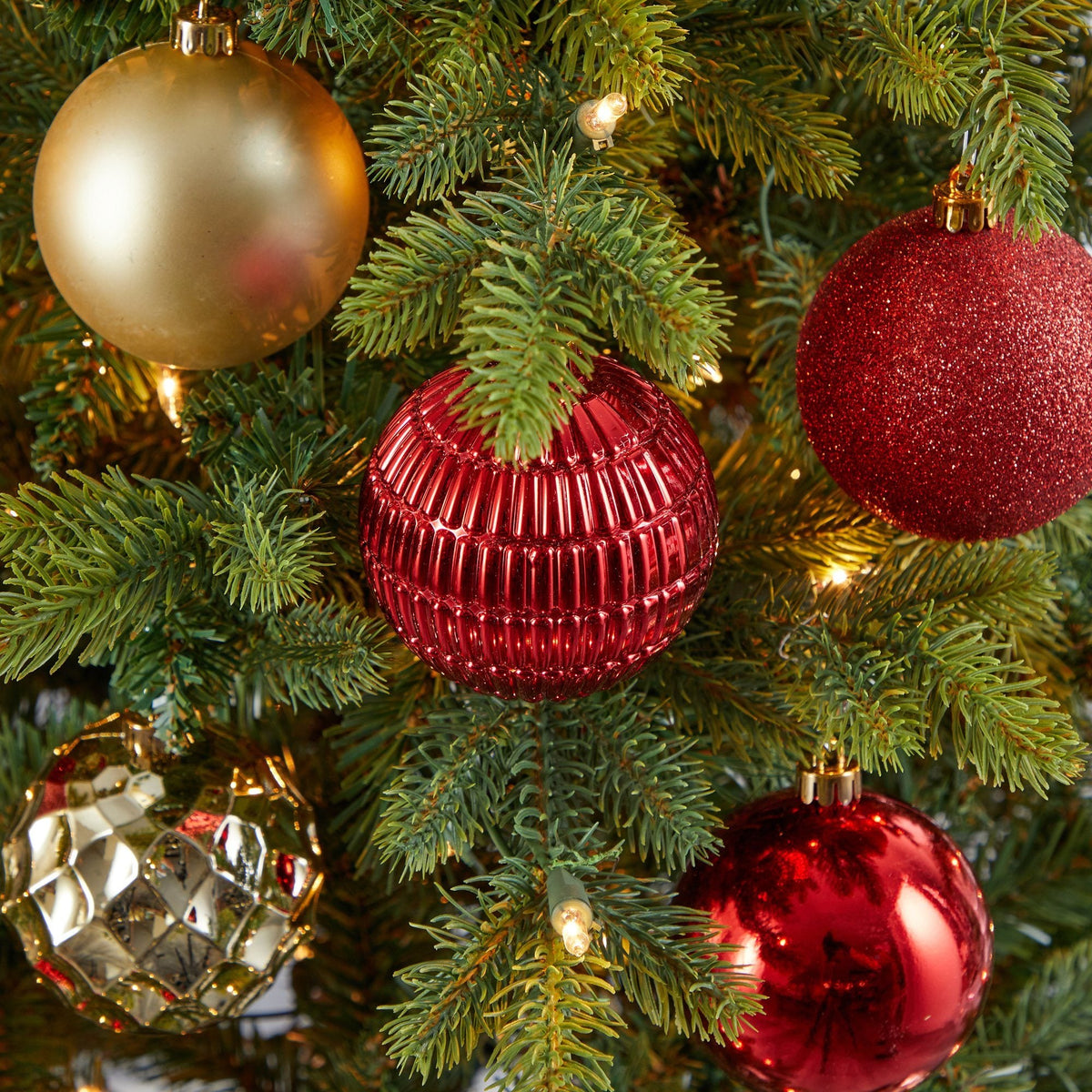 a tree with ornaments and lights