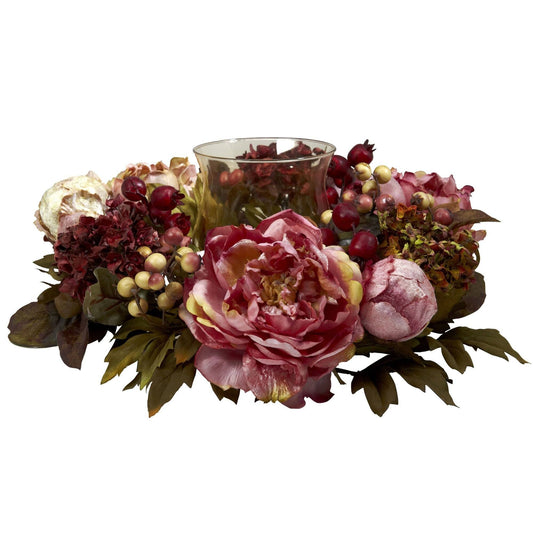 a flower arrangement with a candle