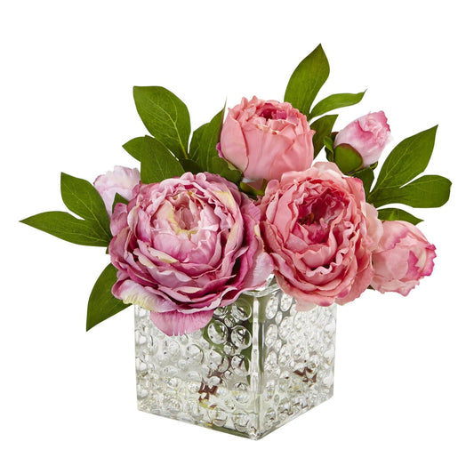 a glass vase with pink flowers