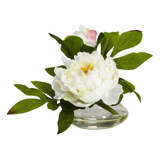 a white flower in a glass vase
