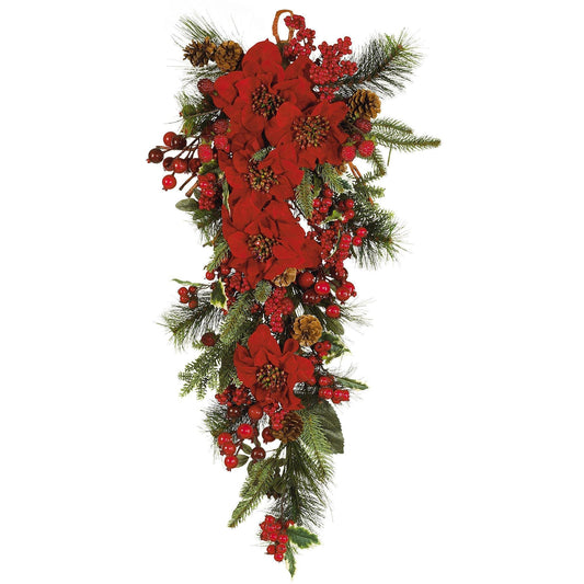 a red flower arrangement with green leaves and berries