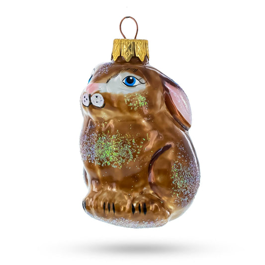 a glass ornament with a rabbit face