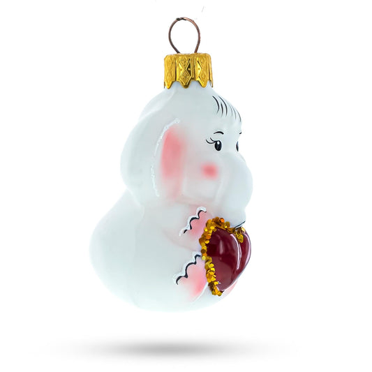 a white ornament with a heart