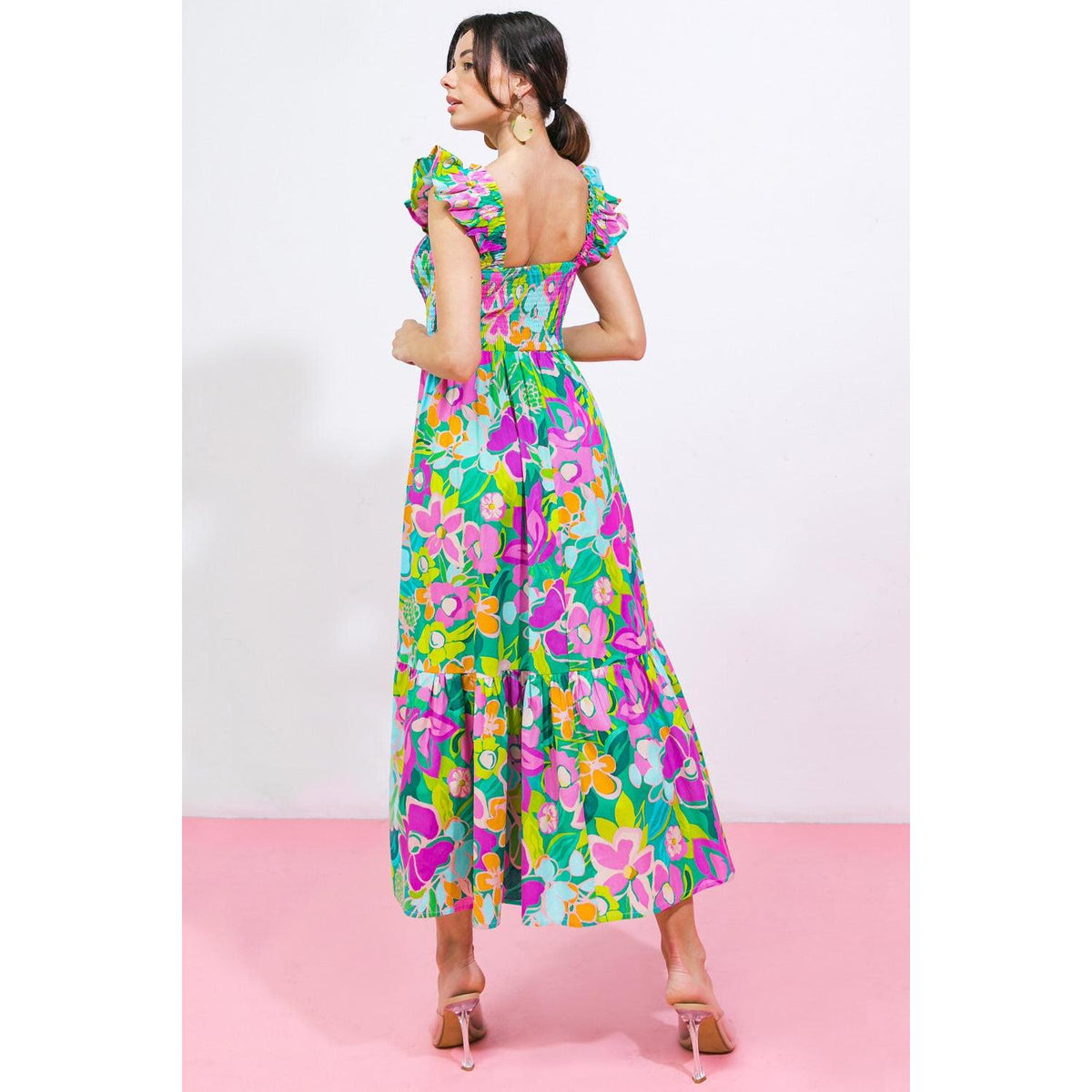 a woman in a floral dress