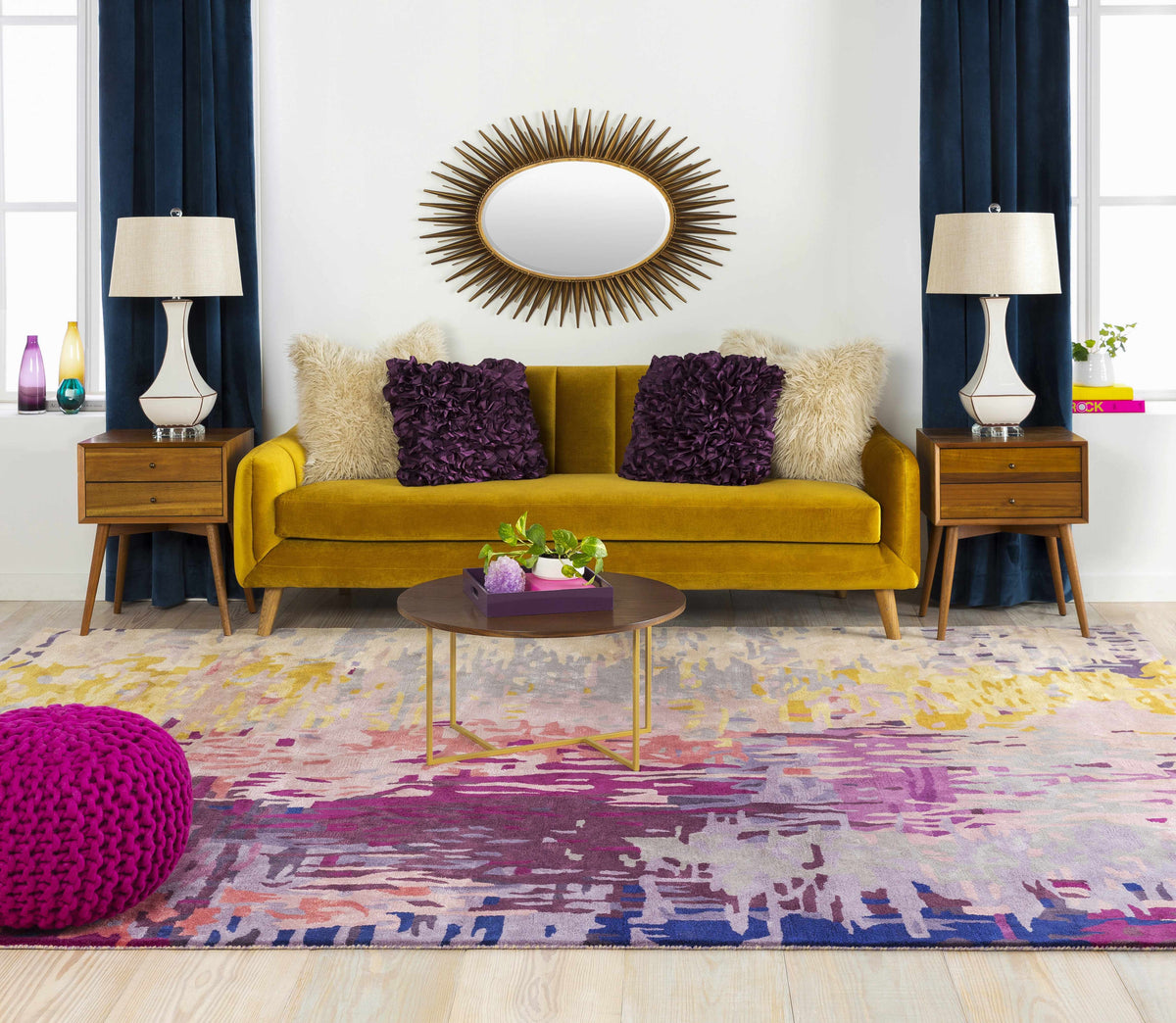 a living room with a yellow couch and purple pillows