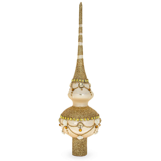 a gold and white christmas tree topper