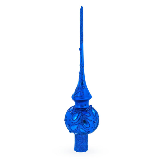 a blue christmas ornament on a white background