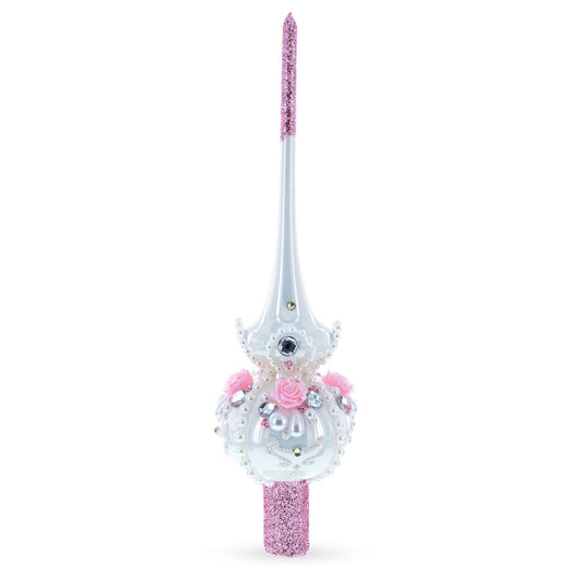a white and pink christmas tree topper